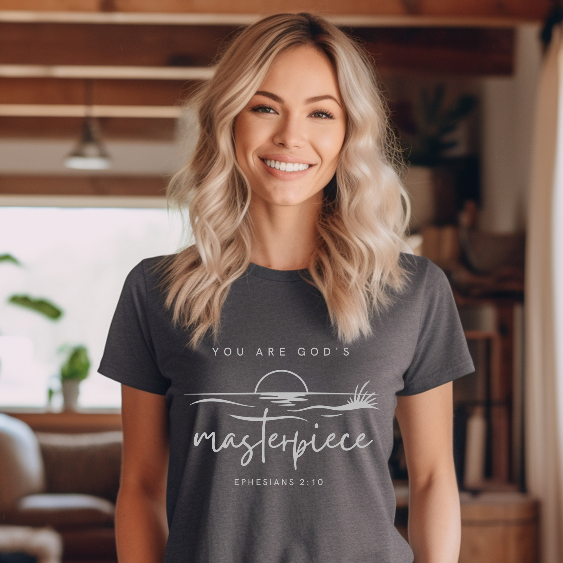 Woman wearing a dark gray t-shirt with a motivational quote in a home setting