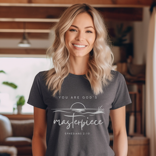 Woman wearing a dark gray t-shirt with a motivational quote in a home setting