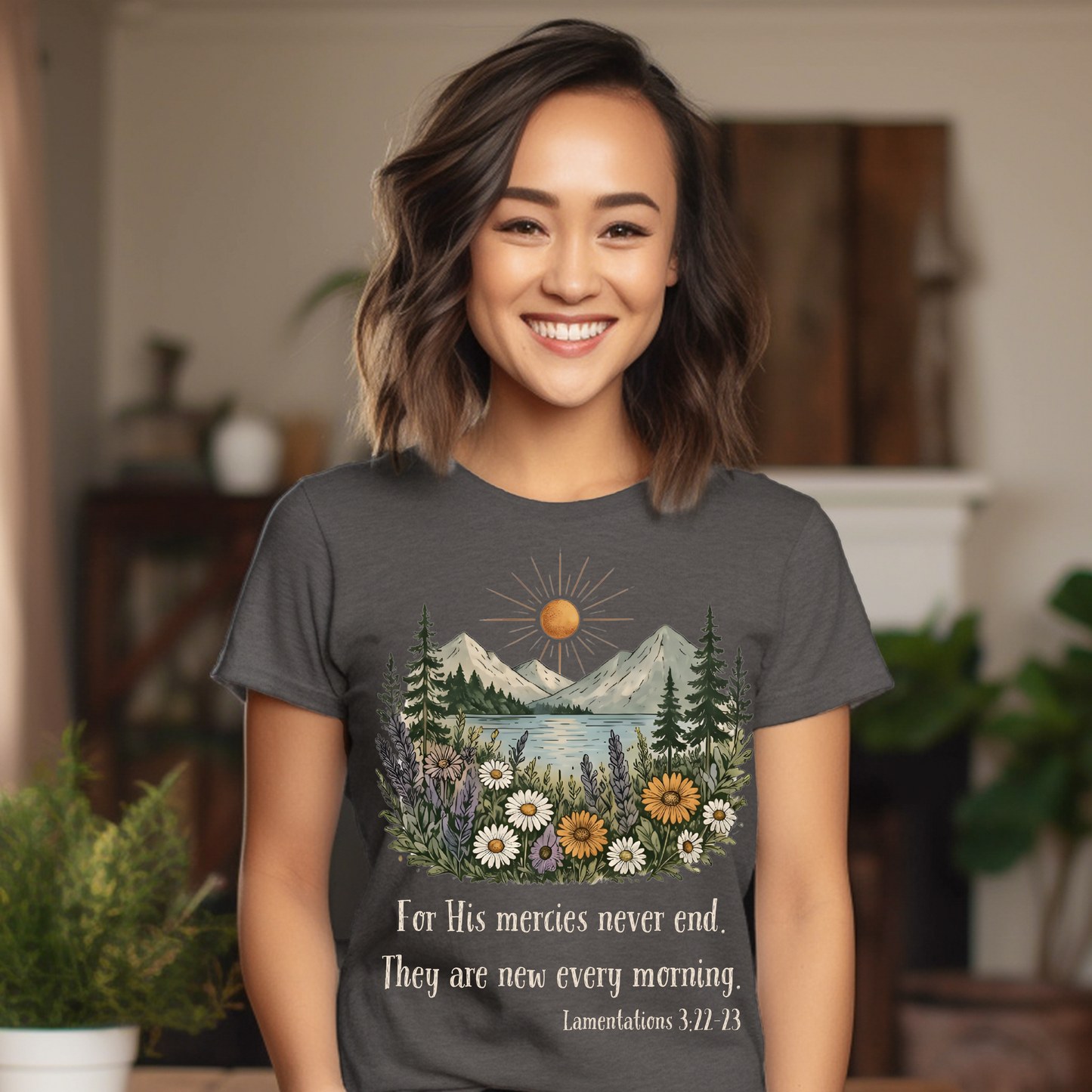 Woman wearing a t-shirt with a nature design and text, standing indoors.