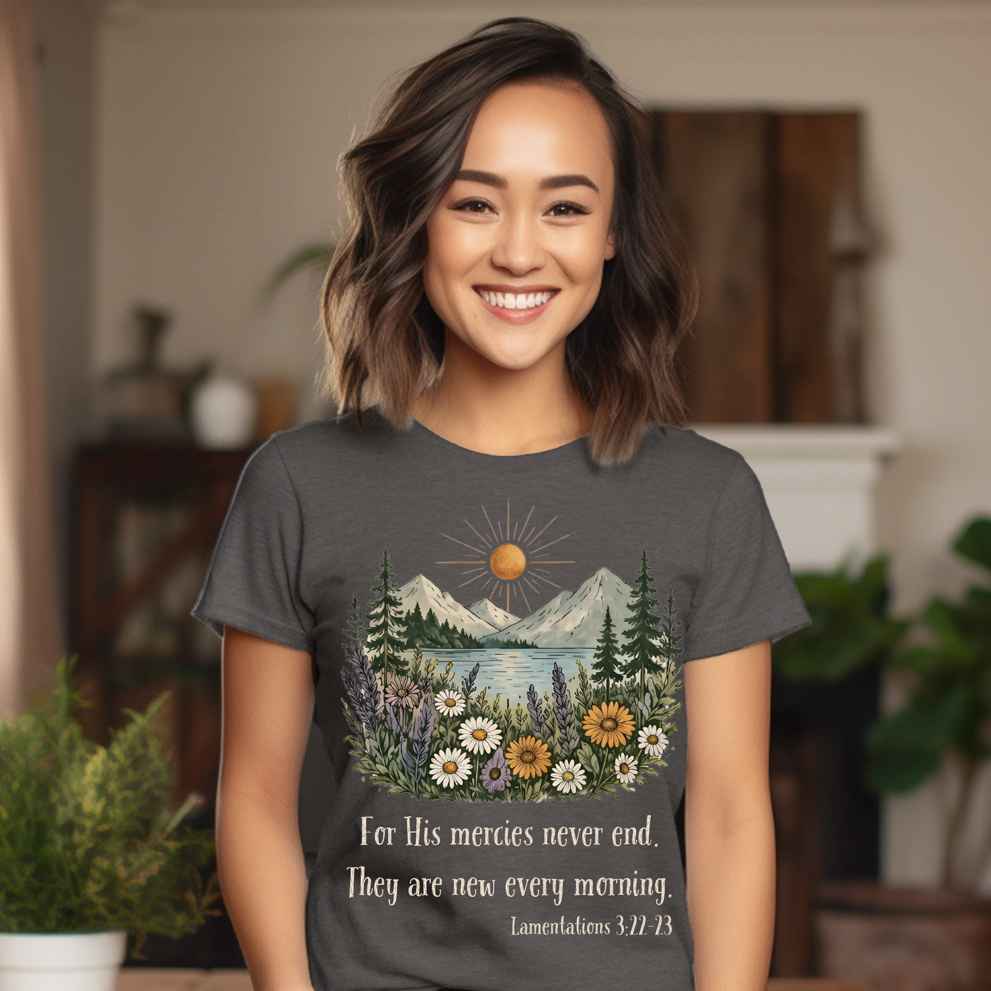 Woman wearing a t-shirt with a nature design and text, standing indoors.
