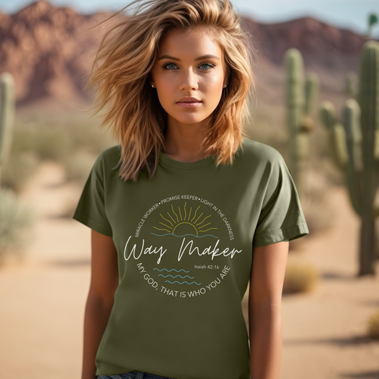 Woman wearing a green t-shirt with text in a desert setting
